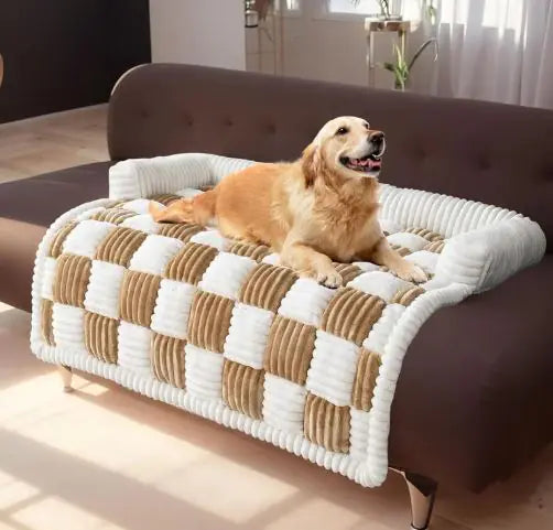 Dog relaxing on a brown and white checkered pet sofa cover on a brown couch.