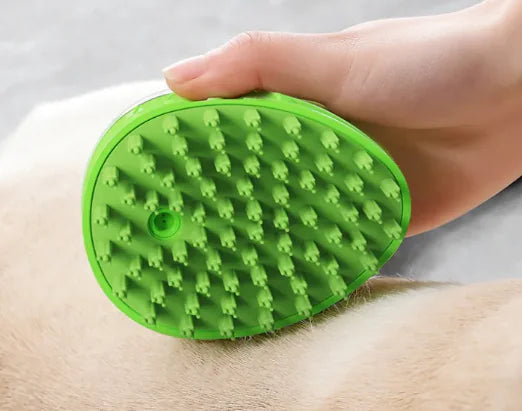 Green (Spring) pet bath brush with soft silicone bristles shown and being held by the ergonomic handle..