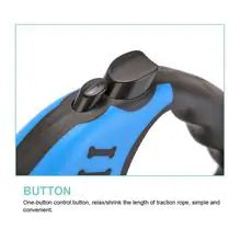 A closeup of the retraction button is shown on a Blue (Lake) and black retractable puppy leash.