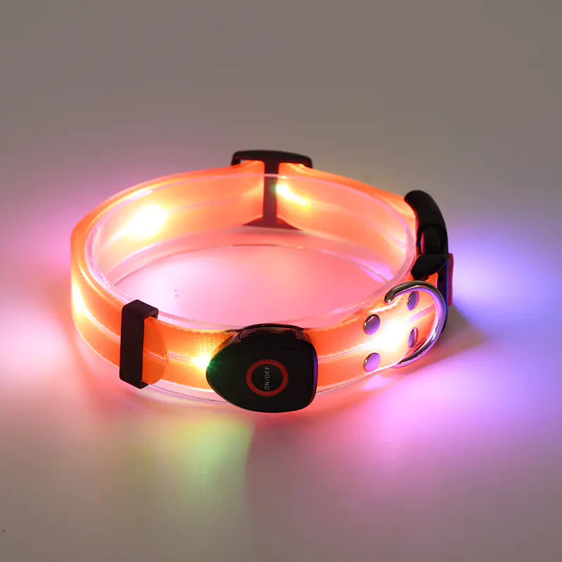 Rechargeable LED dog collar with a metal buckle and Orange (Autumn) lights on a gray background