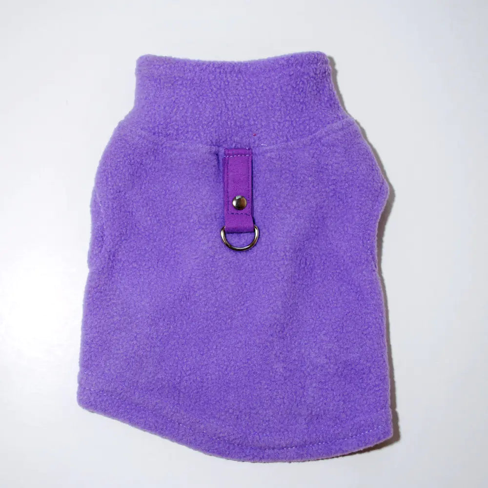 Purple puppy vest harness on a white background. Made of soft polar fleece for your pet's warmth and comfort.