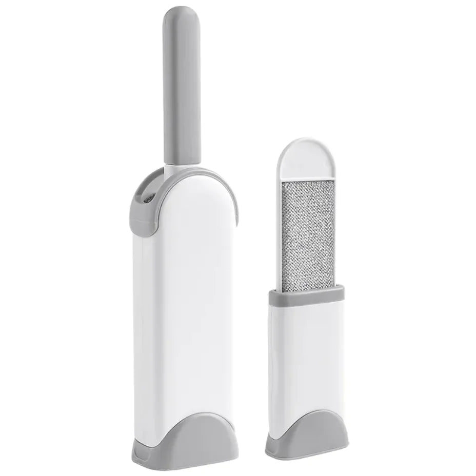 White and gray electrostatic pet grooming brush with a mesh side on a white background