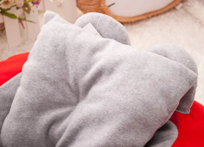 Close up of pillow on Mercedes Benz themed red and gray car-shaped pet bed.