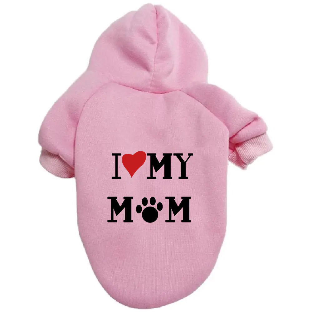 Pink pet hoodie with ‘I ❤️ MY MOM’ print on a white background. Made of soft polyester for your dog's warmth and comfort.