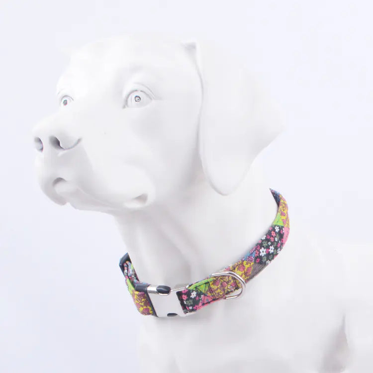 Colorful floral-patterned dog collar with a metal buckle on a mannequin's neck 