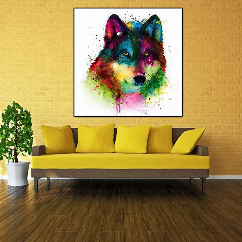 A colorful canvas abstract oil painting print of a wolf's head in a black frame, hung on a gold wall above a gold couch.