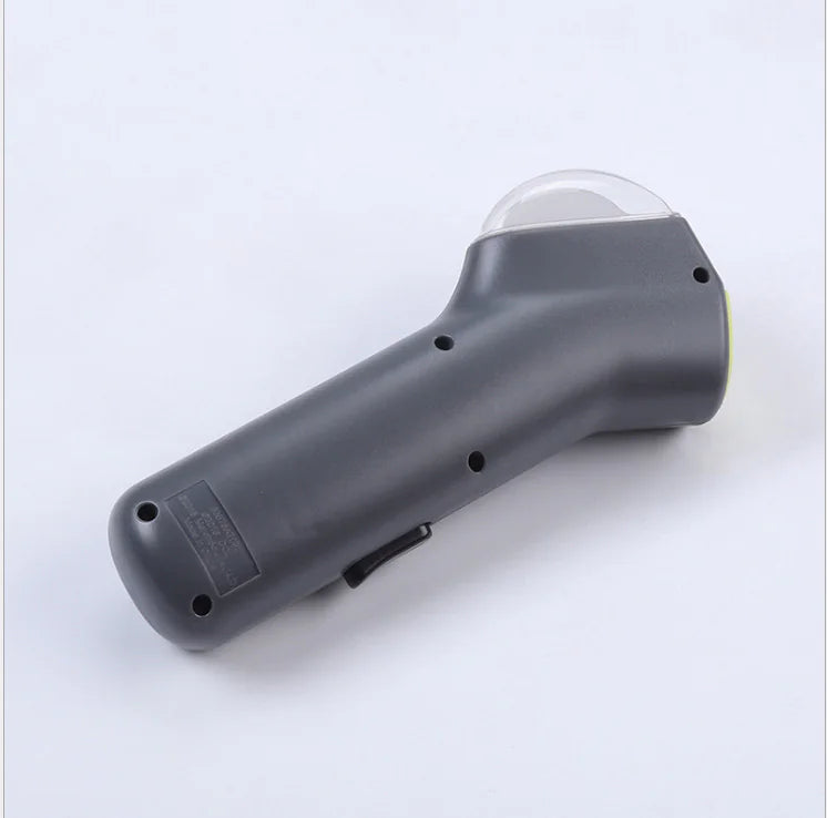 Gray (Mist) colored dog treat launcher with a transparent container on the top end, designed for interactive play and treat distribution.
