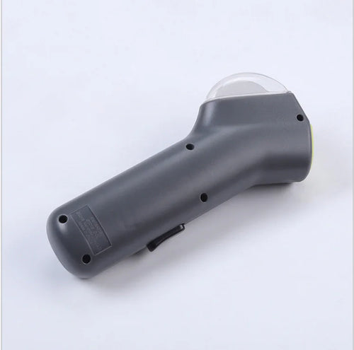 Gray (Mist) colored dog treat launcher with a transparent container on the top end, designed for interactive play and treat distribution.