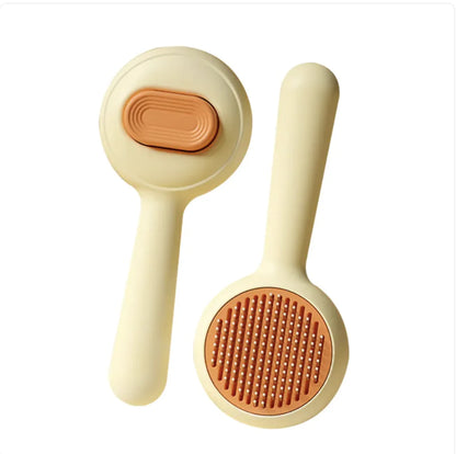 Two skin-friendly yellow dog brushes with a steel comb used for detangling pet fur and removing loose hair.