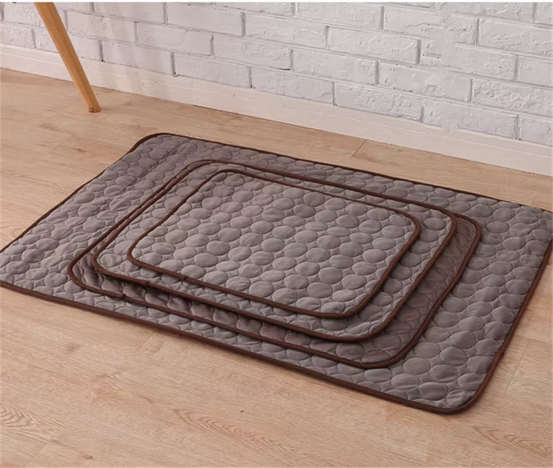 Four Brown (Coffee) textured dog sleeping mats of various sizes. Perfect cooling spot for the puppy after a walk.