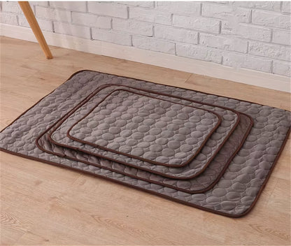 Four Brown (Coffee) textured dog sleeping mats of various sizes. Perfect cooling spot for the puppy after a walk.