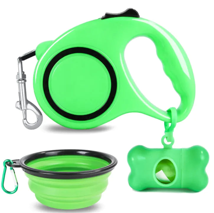 Green (Spring) pet travel kit including a retractable doggy leash, a foldable bowl, and a holder with garbage bag dispensing functionality.