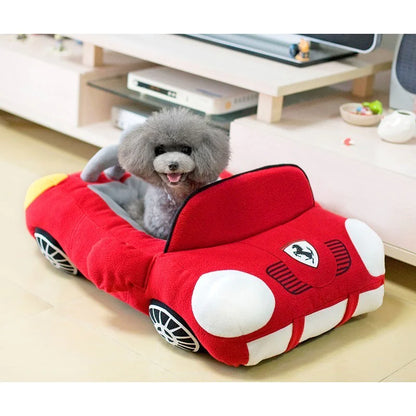Puppy sitting comfortably in a Red (Ruby) luxury designed travel doggy  nest preparing for an exciting trip.