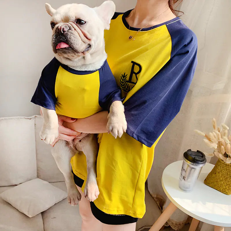 Pet parent and dog modeling their matching Yellow (Sunshine) and blue comfortable and casual cotton shirts.