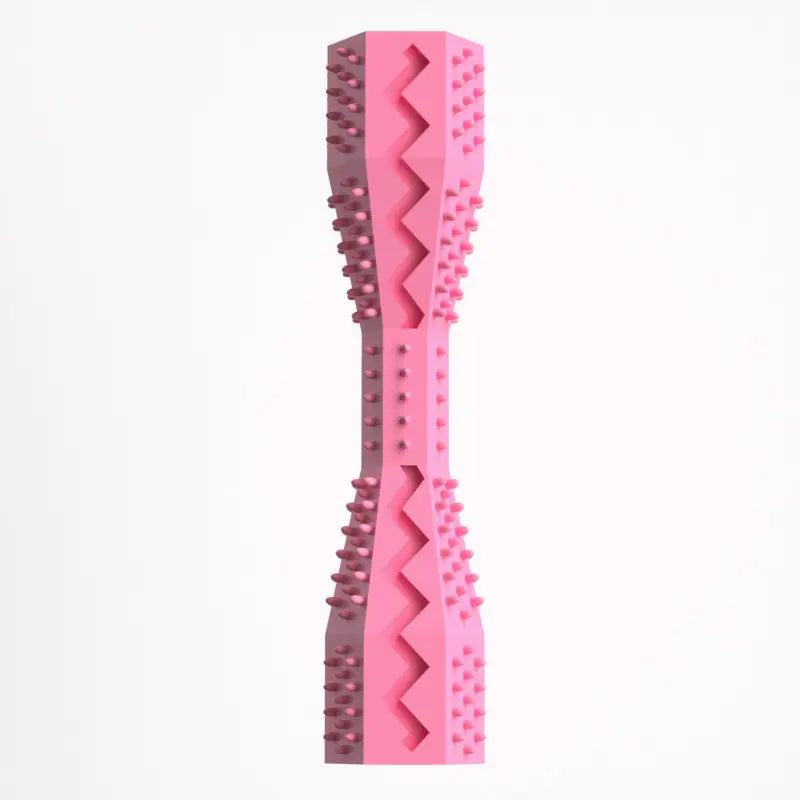 A pink rubber doggie dental stick with textured bristles and ridges for cleaning teeth and massaging gums.