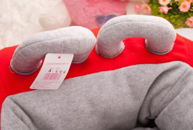 Close up of back end of Mercedes Benz themed red and gray car-shaped pet bed.