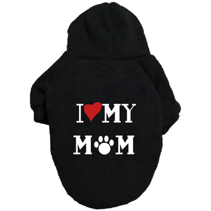 Black pet hoodie with ‘I ❤️ MY MOM’ print on a white background. Made of soft polyester for your doggy's warmth and comfort.