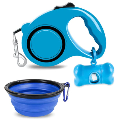 Blue (Lake) doggy travel kit including a retractable dog leash, a foldable bowl, and a holder with garbage bag dispensing functionality.