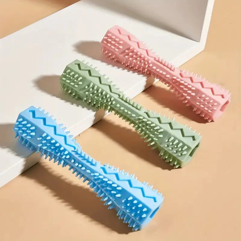 Blue, green, and pink dog chew toys made of pet-safe soft textured rubber that provide both teeth cleaning and gum massage.
