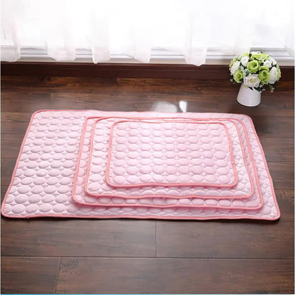 Four of the  pet cooling beds of various sizes. These  self-cooling mats provide a perfect summer chill spot.