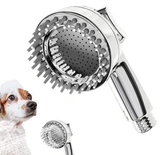 Chrome handheld shower head with soft silicone and dog in the background
