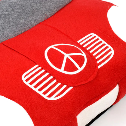 Close up of Mercedes Benz emblem on luxury themed red and gray car-shaped pet bed.