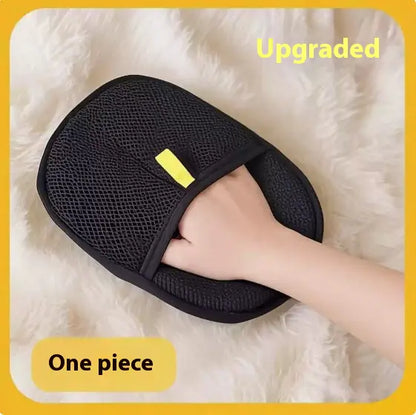 Black grooming and cleaning glove for your dog or cat cleaning a fluffy surface.
