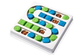 S-Shaped White (Pearl) Dog Puzzle Board with slots for treals. Unique S-Shaped Design combines snack time with game time for your pup.