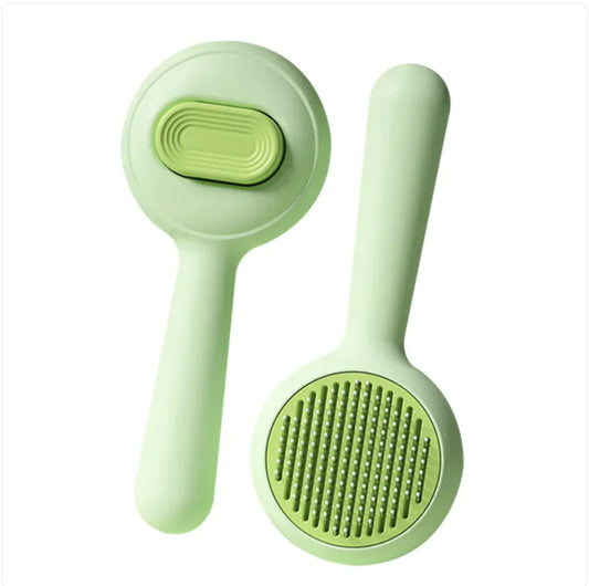 Two skin-friendly green dog brushes with a steel comb used for detangling pet fur and removing loose hair.