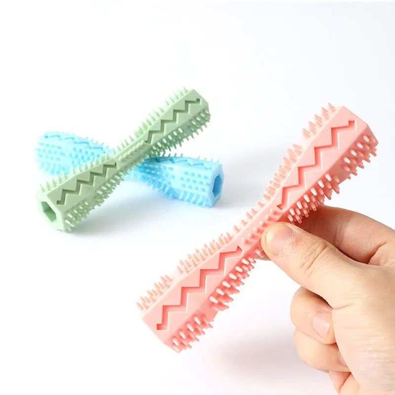 Three rubber doggie dental sticks with textured bristles and ridges for cleaning teeth and massaging gums.