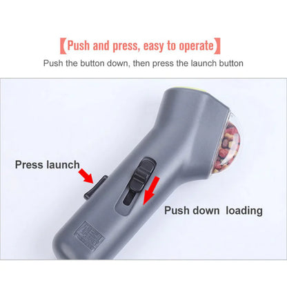 Gray (Mist) colored pup treat launcher shown with operation instructions to launch treats.