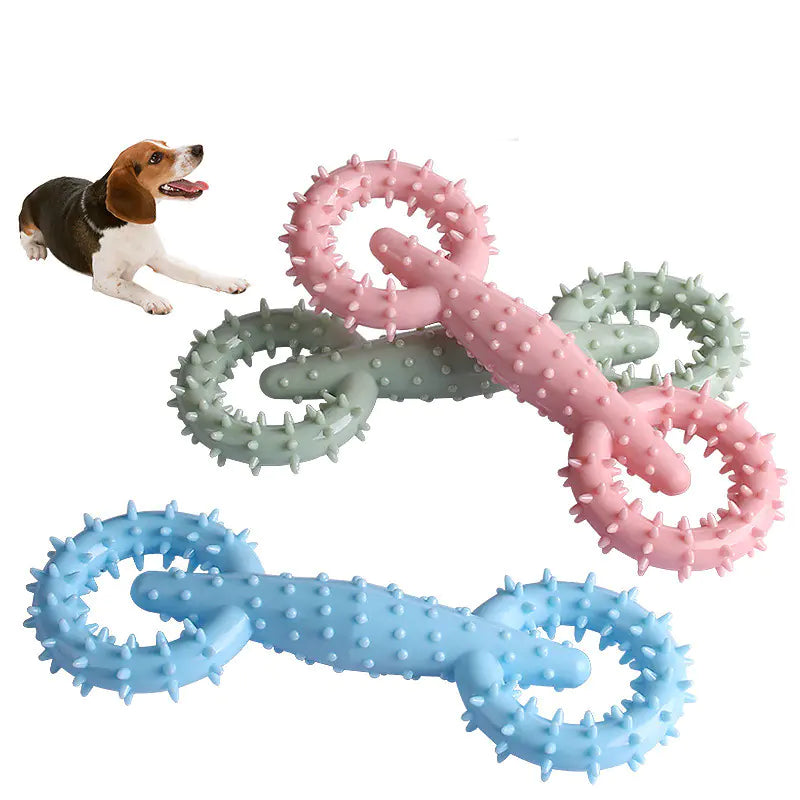 Three doggy chew toys in various colors with dog in background. Spiked texture helps clean teeth and improves your dog's dental hygiene.
