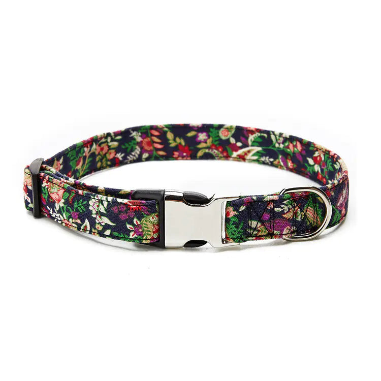 Floral patterned dog collar with a metal buckle on a white background