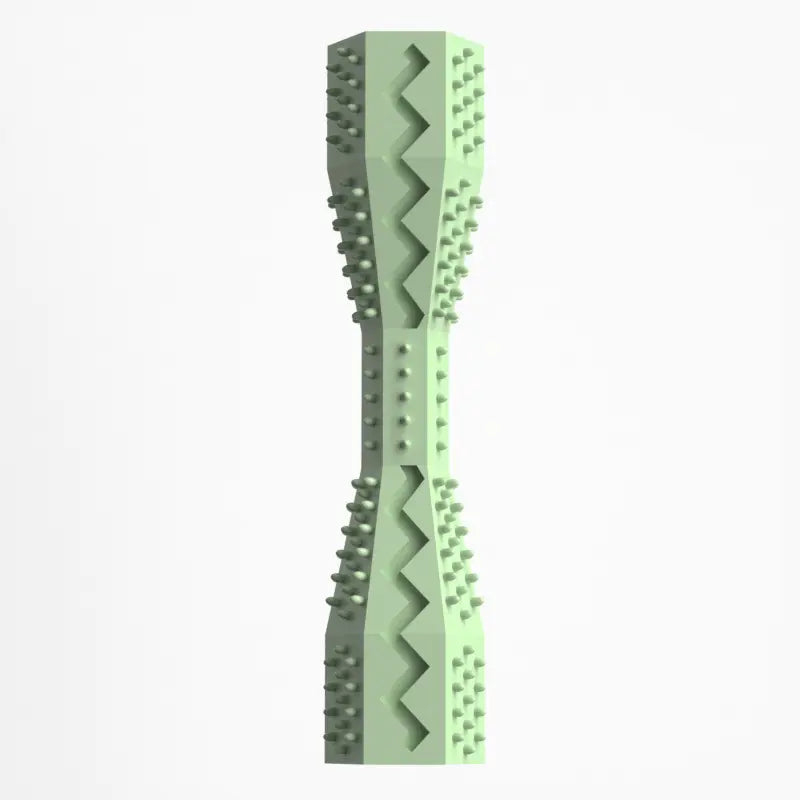 A green rubber doggie dental stick with textured bristles and ridges for cleaning teeth and massaging gums.