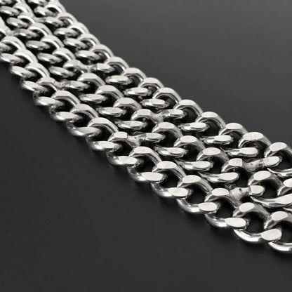 Close-up of a silver dog training chain on a black background
