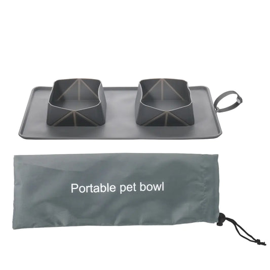 Portable pet bowl made of silicone, displayed with its carrying bag. Bowl and bag have a Gray (Mist) color.