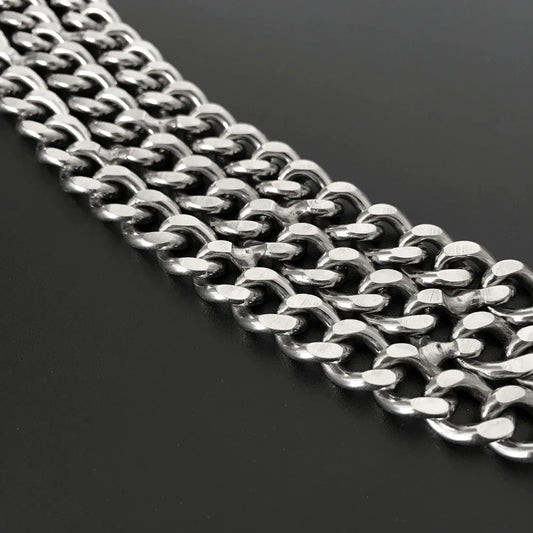 Close-up of a silver dog training chain on a black background