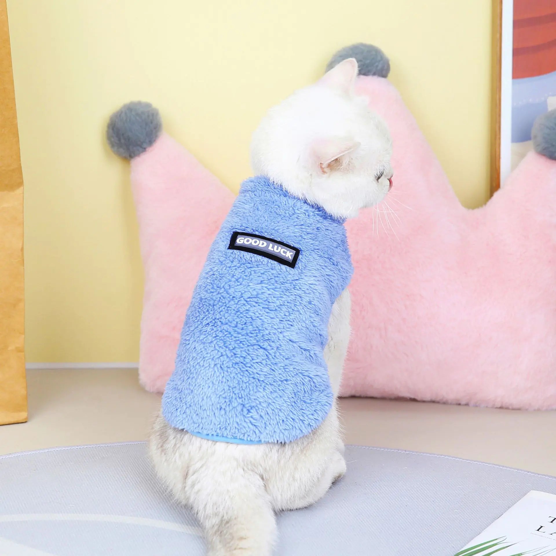 Pet wearing a blue fleece jacket. A snug fit and soft lining ensure your dog stays comfortable on every morning walk.