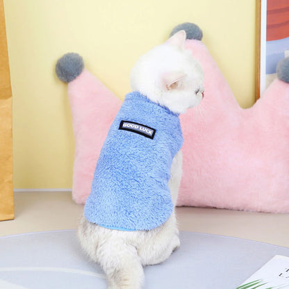 Pet wearing a blue fleece jacket. A snug fit and soft lining ensure your dog stays comfortable on every morning walk.