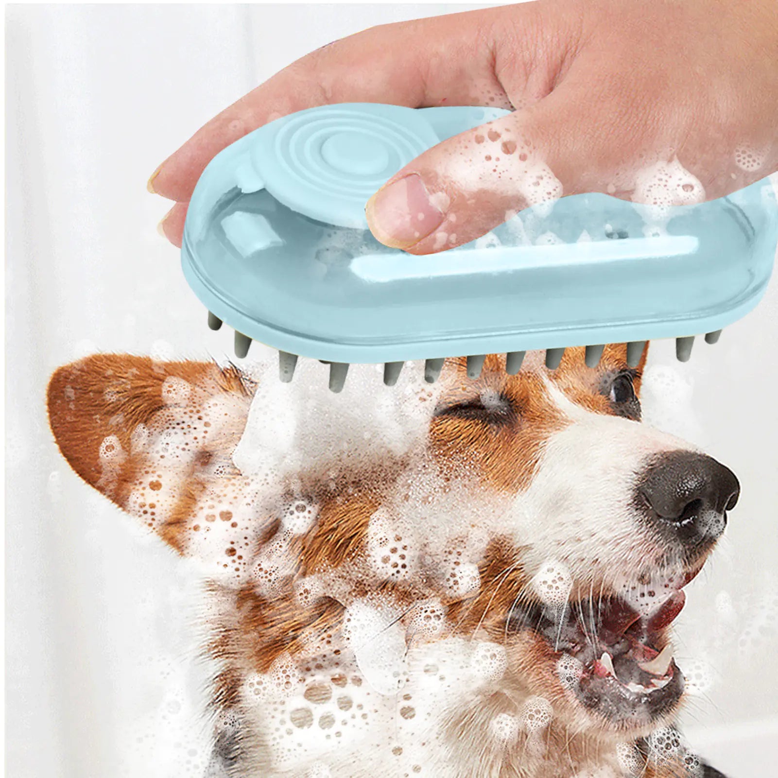 Light Blue (Sky) colored silicone puppy bath brush with a shampoo dispenser being used on a dog appearing to enjoy the bath.