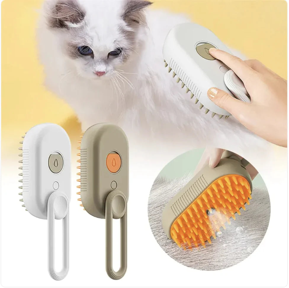 White and brown rechargeable adjustable grooming brushes with steamer for pet massage and deshedding. Kitty is being groomed in the background.