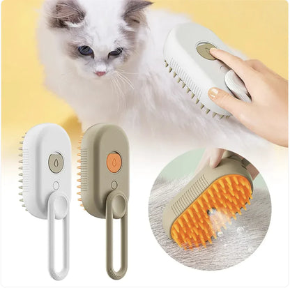 White and brown rechargeable adjustable grooming brushes with steamer for pet massage and deshedding. Kitty is being groomed in the background.