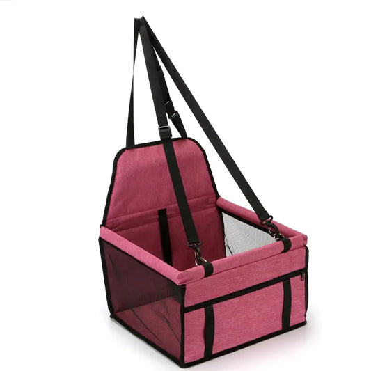 A Pink (Bubblegum) foldable pet safety seat car bag with adjustable straps and a mesh window.