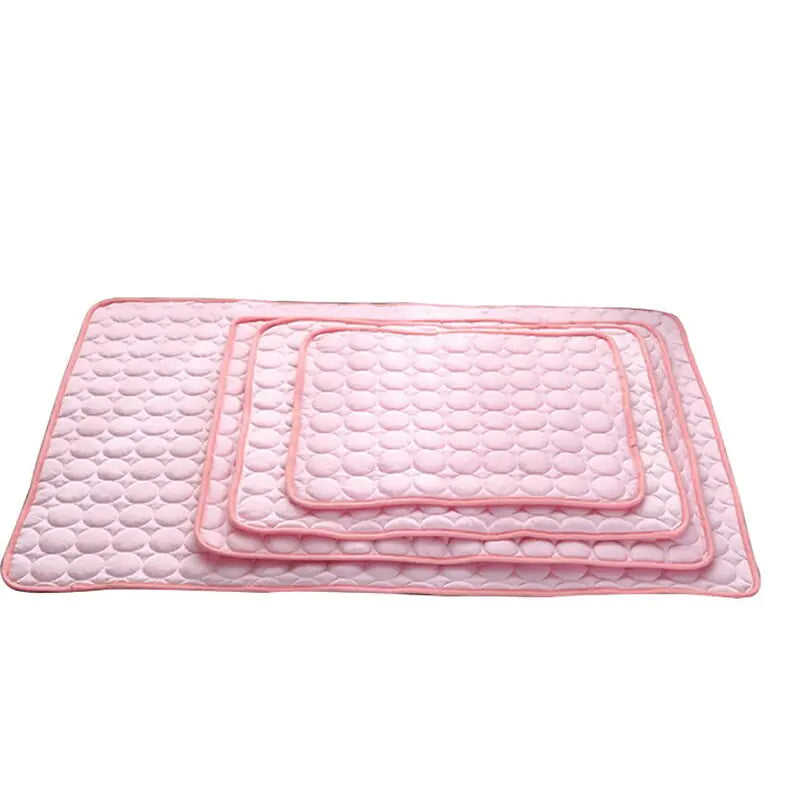 Four of the  pet cooling beds of various sizes. These  self-cooling mats provide a perfect summer chill spot.