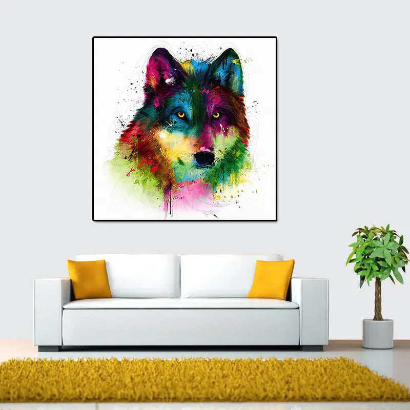 A colorful canvas abstract oil painting print of a wolf's head in a black frame, hung on a wall above a white couch.