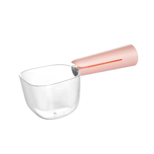 Clear scoop that can be used to precisely measure dog food.. The Pink (Rose) handle, doubles as a bag clip.