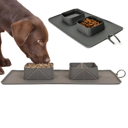 Dog eating from a portable pet feeding system with two bowls and mat. Bowl is portable and made of non toxic silicone.