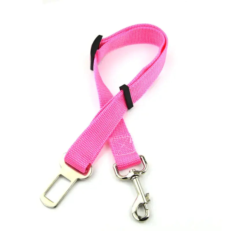 Pink (Rose) adjustable car pet seat belt with a clip that attaches to your dog's collar. Keep your puppy safe while traveling.