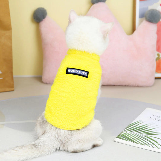 Pet wearing a yellow fleece jacket. A snug fit and soft lining ensure your dog stays comfortable on every morning walk.