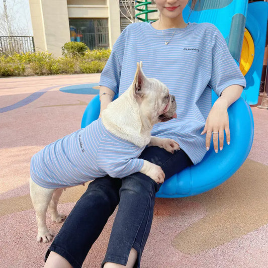 Parent and pet wearing matching Light Blue (Sky) striped shirts. Twinning with your dog makes your walks twice as nice.